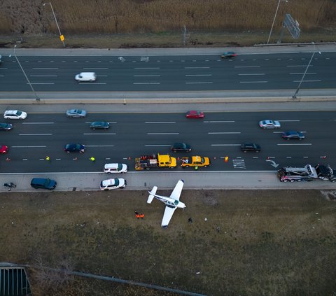 Tense Moments of an Airplane Crash on the Highway, Car Driver Panics as Debris Flies