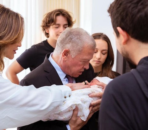 Warm Portrait of King Abdullah and Queen Rania of Jordan Welcoming the Birth of Their First Grandchild