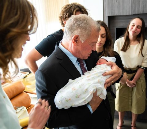 Warm Portrait of King Abdullah and Queen Rania of Jordan Welcoming the Birth of Their First Grandchild