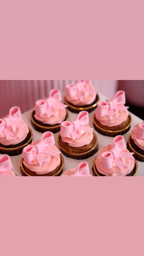 Cupcake is made with beautiful pink ribbon decoration.