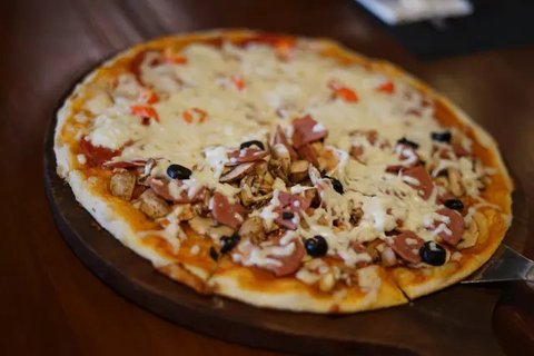 Ilustrasi Pizza. (Foto:AP/AFP)
