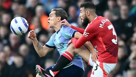 Menjamu Arsenal di Stadion Old Trafford, Manchester United ditahan imbang 1-1. (Paul ELLIS/AFP)