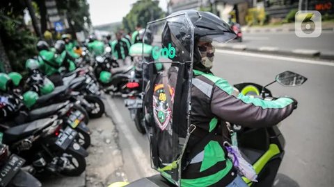 Ilustrasi Driver Grab dengan Helm Baru (Liputan6.com/Jeko Iqbal Reza)