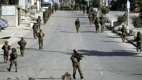 Foto udara ini menunjukkan bangunan-bangunan yang hancur di kawasan Al-Remal, Kota Gaza, pada 23 Oktober 2025. (Foto oleh AFP)