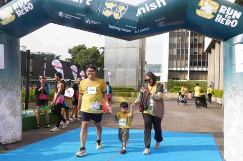 Peserta saat mengikuti Gelaran Run To Hero di Jalan Sudirman, Jakarta, Minggu (30/11/2025).