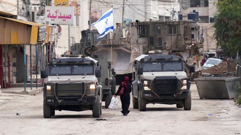 Israeli forces are pressing on with a campaign across the West Bank city of Jenin described as a counterterrorism operation. Palestinian witnesses said several houses have been raided and 10 people killed.