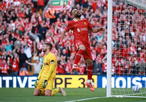 Ekspresi pemain Liverpool Mohamed Salah usai menggolkan gawang Tottenham Hotspur.