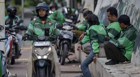 Grab menegaskan pembagian komisi dengan mitra pengemudi ojol telah sesuai regulasi pemerintah, meskipun Komisi V DPR mendorong pembatasan maksimal 10 persen.