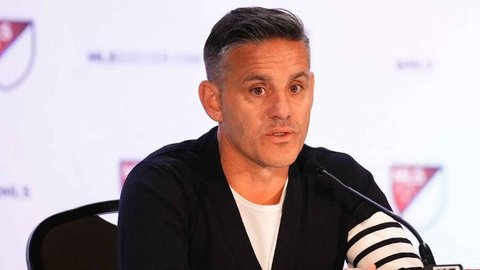 Pelatih timnas Kanada, John Herdman tak dapat menutupi rasa bahagianya usai bisa meloloskan Kanada ke Piala Dunia 2022. (AFP/Geoff Robins)