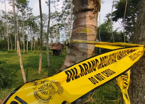 Tempat Kejadian Perkatra pembunuhan dan pemerkosaan CNA bocah 7 tahun yang hingga kini masih dipagar garis polisi untuk kepentingan penyelidikan (Istimewa)