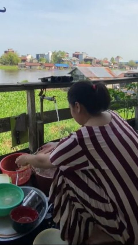 Portrait of Wooden Houses in Kalimantan, Vegetable Planted Back Terrace River View