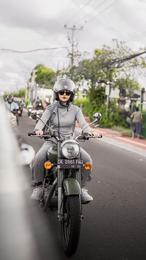 Portrait of Dara Arafah Looking Fierce Riding a Motorcycle Around Komodo Island