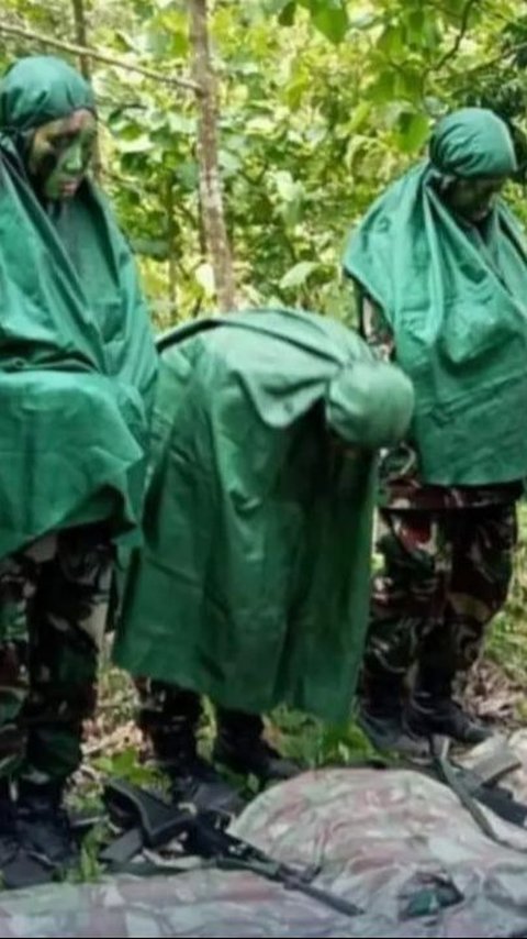 Portrait of Air Force Cadets Praying in the Middle of the Forest During Combat Training, Wearing Camouflage Uniform and Holding Weapons