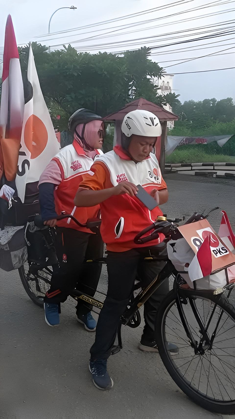 Cerita Pasangan Suami Istri Naik Sepeda dari Yogyakarta Datang ke Kampanye AMIN di JIS