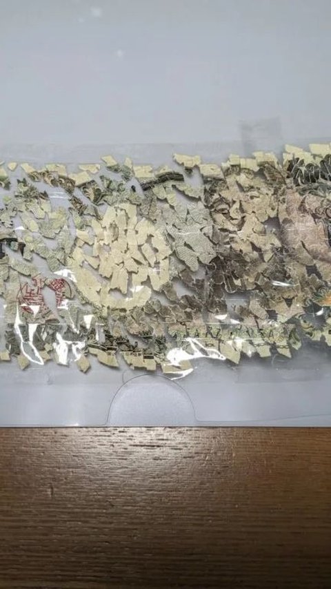 Child in Japan Spends 3 Weeks Assembling 10,000 Pieces of Torn Paper Money to Get a New One