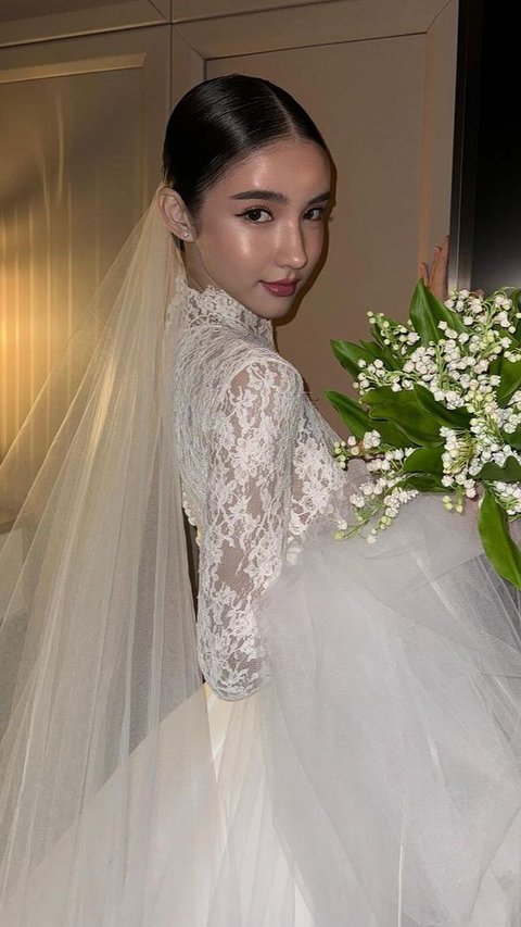Portrait of Anggun Transgender Rinrada Yoshi in a Wedding Dress