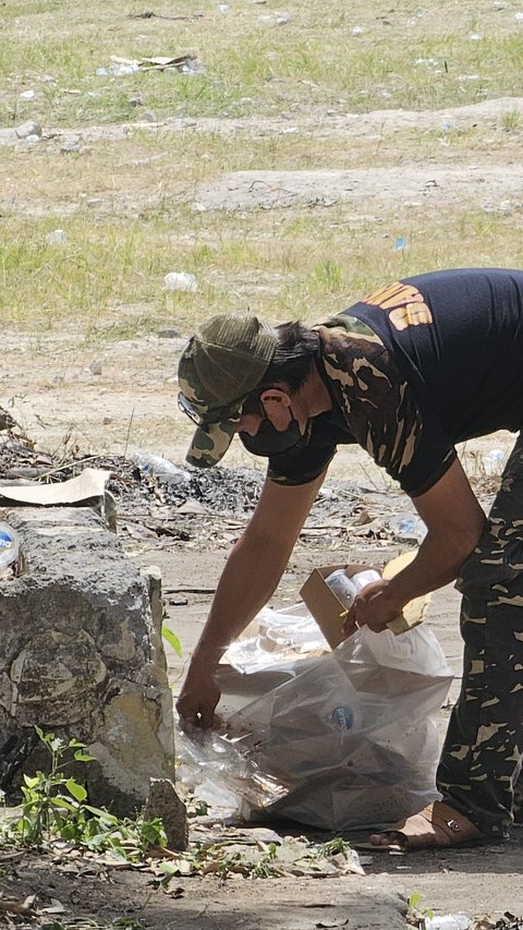 Aksi Kompak, Banser-Pecalang Bersihkan Lokasi Apel Kesetiaan PBNU di Bali