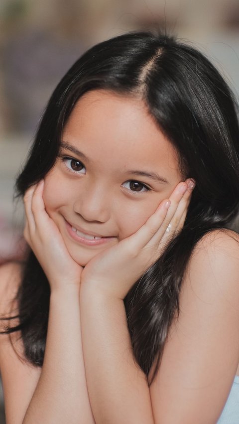 8 Portraits of Gempita, the Child of Gading Marten and Gisella, as Models in the Music Video for the Song 'Gala Bunga Matahari'