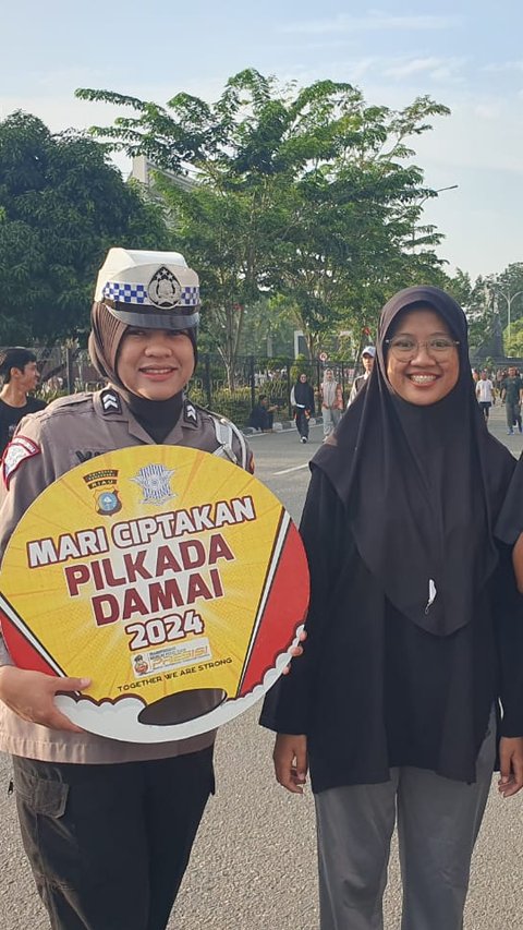 Satlantas Polresta Pekanbaru Pakai Cara Unik Sosialisasi Pilkada Damai di CFD