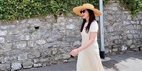 Potret Cantik Nagita Slavina Dalam Balutan Dress Putih di Italia, Pancarkan Aura Wanita Berkelas & Mahal