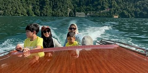 Potret Sus Rini Pengasuh Rayyanza Liburan Mewah di Italia, Naik Pesawat Kelas Bisnis & Nikmati Keindahan Lake Como