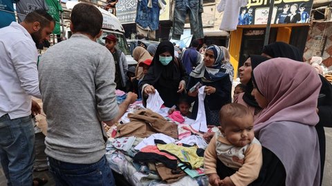 FOTO: Melihat Persiapan Warga Palestina Menyambut Hari Kemenangan Idulfitri di Tengah Ketegangan Gaza dan Tepi Barat