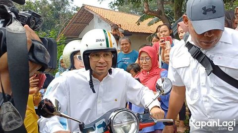 Potret Menggemaskan nan Romantis Raffi Ahmad dan Nagita Slavina Naik Vespa ke TPS saat Akan Nyoblos