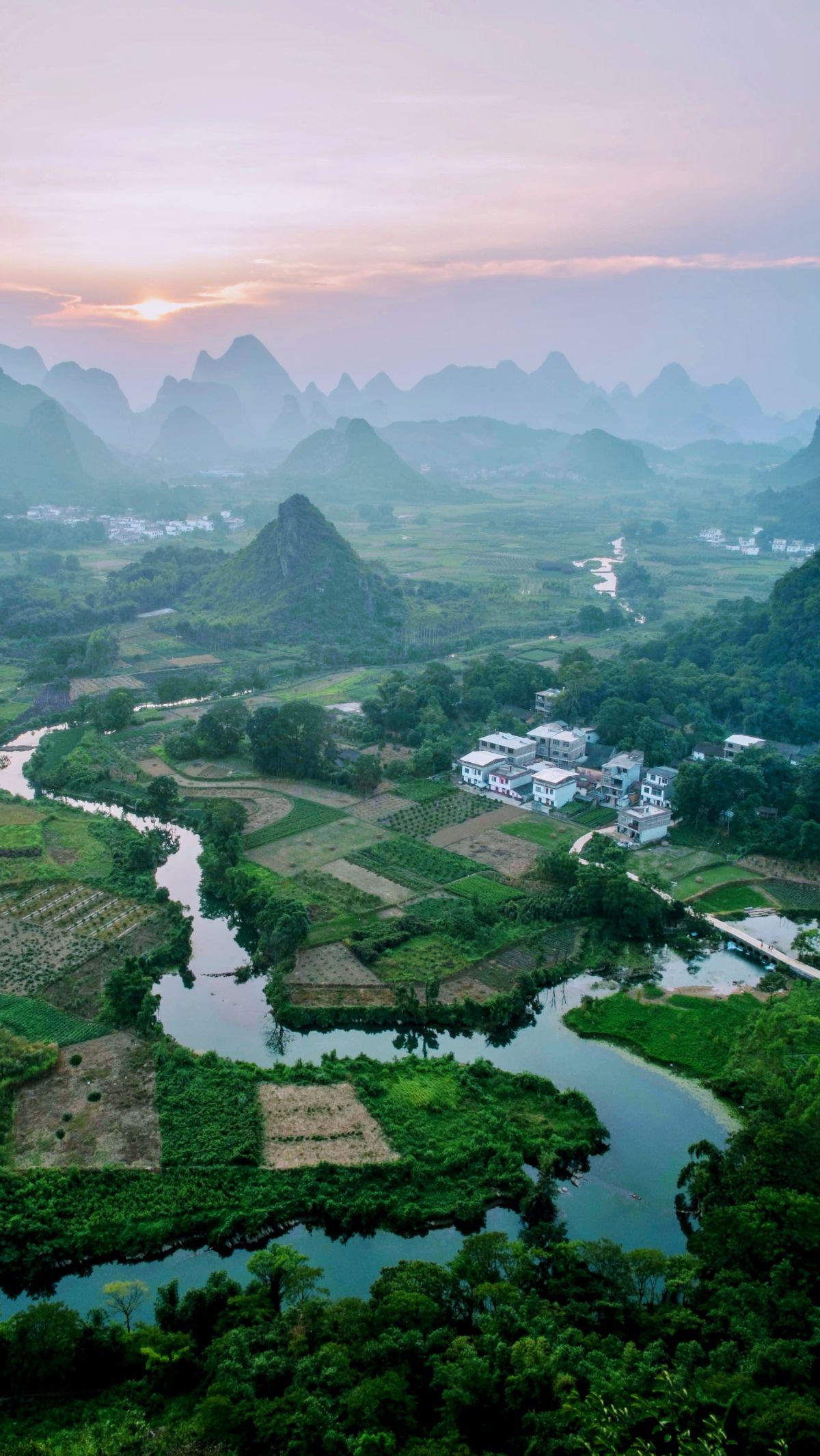 5. Guilin & Yangshuo — China's Most Beautiful Landscape<br><br><br><br> Guilin and Yangshuo in China are famous for their dreamlike landscapes. They have towering limestone peaks that appear dramatically from the earth.