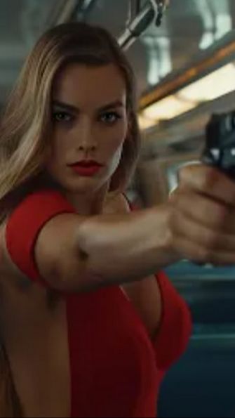 Apart from Cavill, Margot Robbie appeared as a Bond Girl in the video.