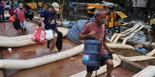 Percepat surut, pompa penyedot air diturunkan