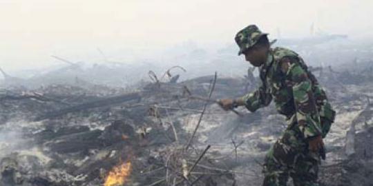 Aksi Kostrad jinakkan asap Riau