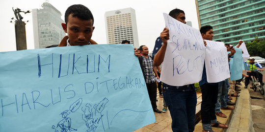 Aksi solidaritas untuk juru parkir Monas yang dibakar oknum TNI