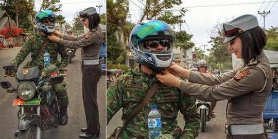 Polwan cantik rapikan tali helm anggota TNI