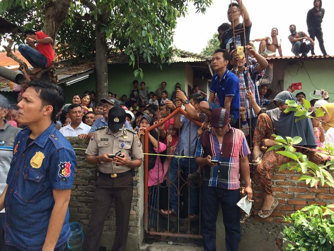 rekonstruksi pembunuhan sekeluarga di medan