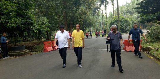 Menebak makna 'kaus kuning' Jokowi saat olahraga bersama Airlangga