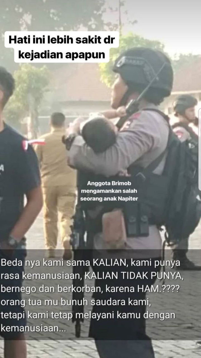 anggota polri gendong bayi napiter