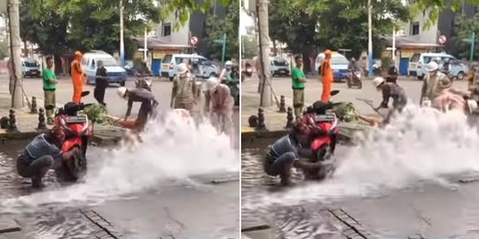 Air PDAM Bocor dan Berhamburan ke Jalan, Bapak Ini Asyik Nyuci Motor