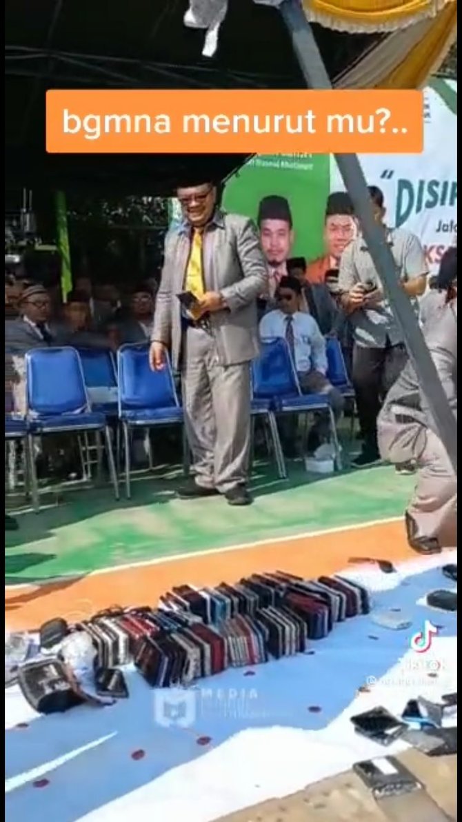 guru hancurkan hp sitaan di depan siswa