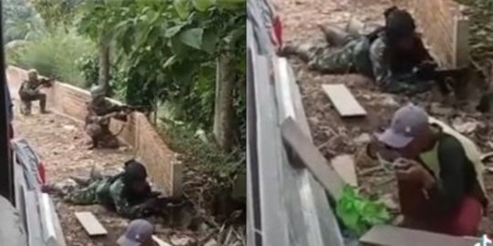 Pria Asyik Santai Makan di Samping Para Tentara yang Adu Tembak, Sikapnya Bikin Heran