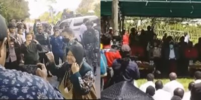 menunggu ibu mensos polisi di puncak jaya papua berjaga sambil makan nasi bungkus