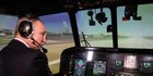 Gaya Putin Jajal Simulator Helikopter Angkut Militer Terbesar di Ulan-Ude
