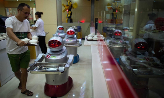 Restoran di China ini pekerjakan robot sebagai koki dan pelayan