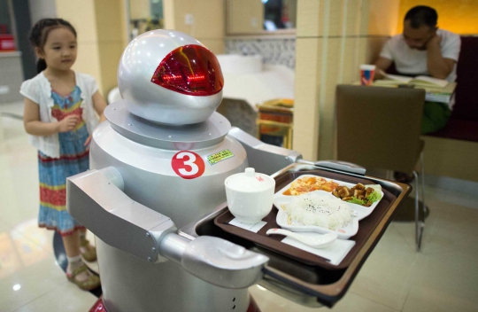 Restoran di China ini pekerjakan robot sebagai koki dan pelayan