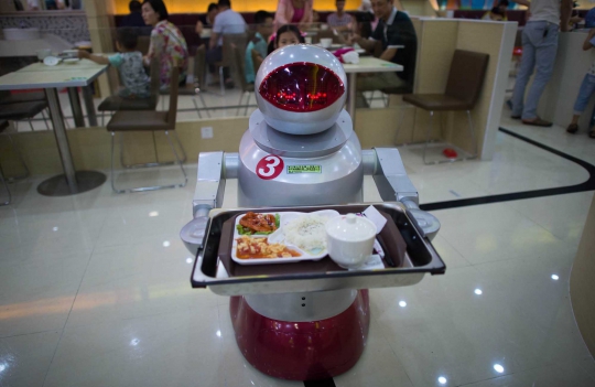 Restoran di China ini pekerjakan robot sebagai koki dan pelayan