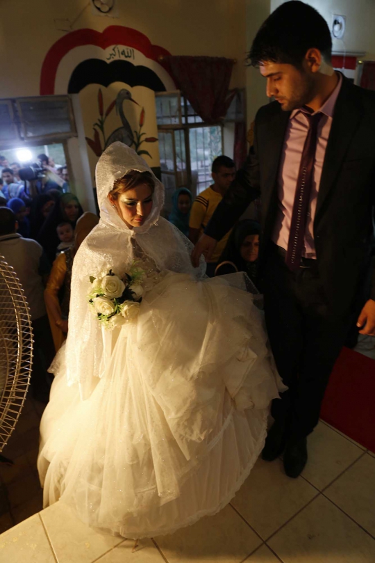 Lari dari ISIS, pria Syiah & wanita Sunni menikah di pengungsian