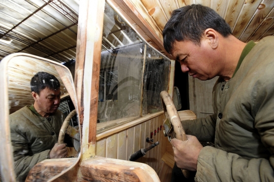 Mobil listrik ala tukang kayu China ini dilengkapi 'rudal'