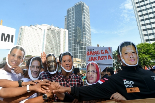 Massa bertopeng Cagub-Cawagub DKI gelar aksi kampanye damai