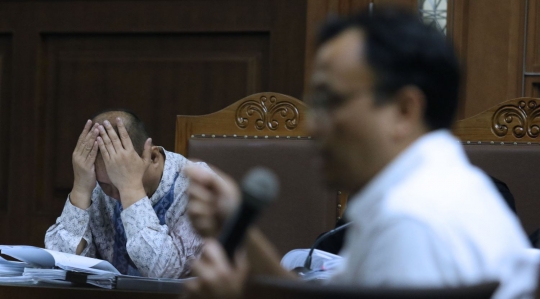 Ekspresi Syafruddin Arsyad Temenggung saat jalani sidang lanjutan korupsi SKL BLBI