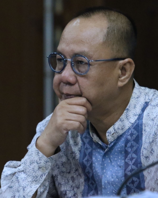 Ekspresi Syafruddin Arsyad Temenggung saat jalani sidang lanjutan korupsi SKL BLBI