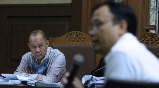 Ekspresi Syafruddin Arsyad Temenggung saat jalani sidang lanjutan korupsi SKL BLBI